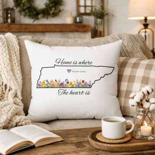 Decorative pillow with a quote on a couch in a cozy living room setting.